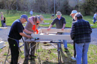 Volunteers building community gardens in Picton